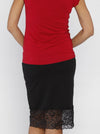 Back view - A woman in Stretchy Maternity Black Skirt with Lace Details (10088240838)